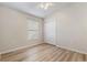 Bright bedroom with plank flooring, a ceiling fan, a window for natural light, and a closet at 1018 Highland Meadows St, Davenport, FL 33837