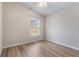 This bedroom has a ceiling fan and a window at 1018 Highland Meadows St, Davenport, FL 33837