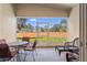 Relaxing screened lanai featuring comfortable seating and a view of the backyard at 1018 Highland Meadows St, Davenport, FL 33837