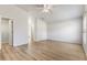 Large bedroom with laminate flooring, a ceiling fan, neutral colors, and great natural light at 1018 Highland Meadows St, Davenport, FL 33837