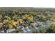 Stunning aerial view of the property showcasing the lush greenery and mature trees in a neighborhood setting at 1149 Doyle Rd, Deltona, FL 32725