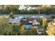 Captivating aerial shot displaying the home's pool, spacious yard, and the surrounding mature landscape at 1149 Doyle Rd, Deltona, FL 32725