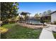 This backyard features a stone walkway to a gazebo overlooking a pool at 1149 Doyle Rd, Deltona, FL 32725
