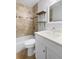 This bathroom features a shower, a mirror, shelves, and a toilet at 1149 Doyle Rd, Deltona, FL 32725