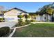 Charming one-story home featuring well-manicured landscaping and an attached two-car garage at 1149 Doyle Rd, Deltona, FL 32725