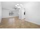 Spacious living room featuring tile flooring, neutral walls, ceiling fan and dining area at 1149 Doyle Rd, Deltona, FL 32725