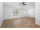 Bright living room featuring neutral walls, tile flooring, a ceiling fan and natural light at 1149 Doyle Rd, Deltona, FL 32725