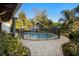 Gorgeous pool area with brick pavers, fenced pool with lush landscaping around the perimeter of the backyard at 1149 Doyle Rd, Deltona, FL 32725
