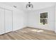 Bright bedroom features a modern light fixture and spacious layout at 11706 Regal Ridge Ln, Clermont, FL 34711