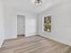 Bedroom features a neutral color palette and wood-look flooring at 11706 Regal Ridge Ln, Clermont, FL 34711