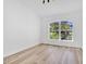 Bright bedroom boasts a large window offering neighborhood views at 11706 Regal Ridge Ln, Clermont, FL 34711