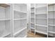 Spacious walk-in closet with ample shelving and storage solutions for organization at 11706 Regal Ridge Ln, Clermont, FL 34711