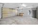 Spacious garage with ample storage space and a workbench at 11706 Regal Ridge Ln, Clermont, FL 34711