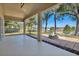 Covered patio includes an outdoor fire pit overlooking the backyard at 11706 Regal Ridge Ln, Clermont, FL 34711