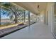 Covered patio features an outdoor fire pit and lovely backyard views at 11706 Regal Ridge Ln, Clermont, FL 34711