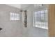 Walk in shower features tile surround and shower system at 11706 Regal Ridge Ln, Clermont, FL 34711