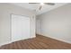 Bedroom with wood floors, large closet and a ceiling fan at 12008 Villanova Dr # 112, Orlando, FL 32837