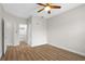 Bright bedroom with wood-look flooring and a ceiling fan at 12008 Villanova Dr # 112, Orlando, FL 32837