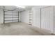 Spacious two car garage with shelving and a storage closet at 12008 Villanova Dr # 112, Orlando, FL 32837