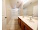 Bright bathroom features double sink vanity and glass-enclosed shower at 14448 Pleach St, Winter Garden, FL 34787