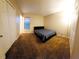 Cozy bedroom with carpet floors, closet, and natural light at 14448 Pleach St, Winter Garden, FL 34787