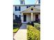 Charming townhome entrance with a well-maintained front yard, brick pathway, and inviting front door at 14448 Pleach St, Winter Garden, FL 34787