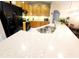 Kitchen with granite countertops, stainless steel sink, wood cabinets, and black appliances at 14448 Pleach St, Winter Garden, FL 34787
