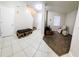 Open living area featuring tiled floors, carpet, and comfortable seating with lots of space for activities at 14448 Pleach St, Winter Garden, FL 34787