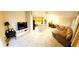 Spacious open living area with tile flooring, pendant lighting, and a leather sofa near the kitchen at 14448 Pleach St, Winter Garden, FL 34787