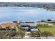 Lakeside home surrounded by lush landscaping with private boat dock and expansive lake views at 14544 Avenue Of The Rushes, Winter Garden, FL 34787