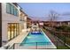 The home showcases a pool, spa, outdoor seating, and access to the green yard and lake at 14544 Avenue Of The Rushes, Winter Garden, FL 34787
