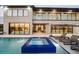 Home back exterior featuring a pool, spa, patio with outdoor seating, and large windows at 14544 Avenue Of The Rushes, Winter Garden, FL 34787