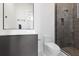 Modern bathroom featuring a gray cabinet vanity, sleek fixtures, and glass enclosed shower at 14544 Avenue Of The Rushes, Winter Garden, FL 34787