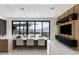 Elegant dining space with lake views, modern lighting, and stylish decor at 14544 Avenue Of The Rushes, Winter Garden, FL 34787