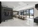Open-concept kitchen featuring an island with bar seating, stainless steel appliances, and direct access to the outdoor patio at 14544 Avenue Of The Rushes, Winter Garden, FL 34787
