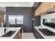 Contemporary kitchen featuring stainless steel appliances, quartz countertops, modern gray cabinetry and marble-look floors at 14544 Avenue Of The Rushes, Winter Garden, FL 34787