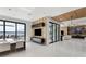 Stylish open-concept living space with lake views, modern decor, and wood paneling accents at 14544 Avenue Of The Rushes, Winter Garden, FL 34787