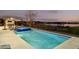 Beautiful pool and spa overlooking the lake with outdoor kitchen and dining area at 14544 Avenue Of The Rushes, Winter Garden, FL 34787