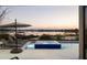 Relaxing pool and spa area overlooking a serene lake, offering a tranquil outdoor retreat with lounge chairs at 14544 Avenue Of The Rushes, Winter Garden, FL 34787
