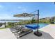 Relax by the pool on these lounge chairs and enjoy the tranquil waterfront views from your private backyard oasis at 14544 Avenue Of The Rushes, Winter Garden, FL 34787