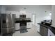 Modern kitchen with stainless steel appliances and ample cabinet space at 14712 Eagles Crossing Dr, Orlando, FL 32837