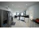 Spacious kitchen with stainless steel appliances, white cabinets and center island at 14712 Eagles Crossing Dr, Orlando, FL 32837