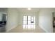 Bright, airy living room leads to a screened back porch and the lake view beyond at 14712 Eagles Crossing Dr, Orlando, FL 32837