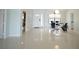 Bright and open living room area with tile flooring and a modern light fixture at 14712 Eagles Crossing Dr, Orlando, FL 32837