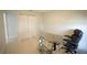 A flexible office space with neutral decor featuring modern glass desk at 14712 Eagles Crossing Dr, Orlando, FL 32837