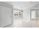 Dining area with lots of natural light, neutral paint and flooring, and a hanging light fixture at 1499 Courtland Blvd, Deltona, FL 32738