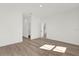 A bright bedroom with wood-look floors and white trim offers a calming, neutral palette at 15354 Sw 43Rd Avenue Rd, Ocala, FL 34473