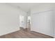Bright bedroom featuring wood-look floors and a closet with double doors for ample storage at 15354 Sw 43Rd Avenue Rd, Ocala, FL 34473