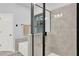 Contemporary bathroom featuring a glass shower and a luxurious soaking tub at 17052 Cercis Loop, Clermont, FL 34711