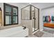 Beautiful bathroom features a shower, tub, and luxurious design at 17052 Cercis Loop, Clermont, FL 34711
